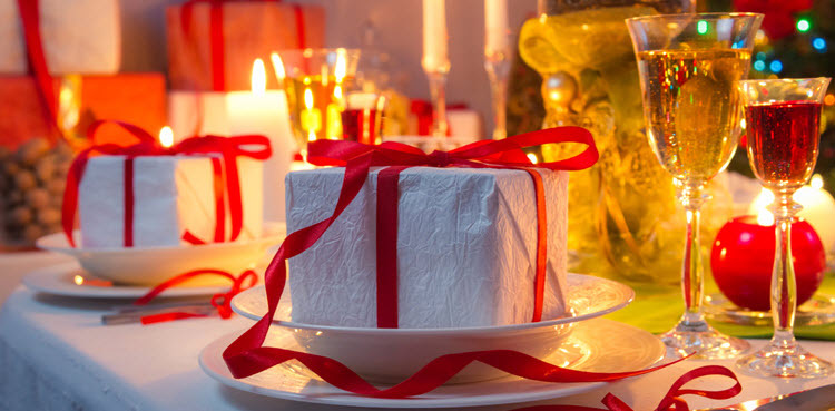 table with christmas decorations presents wine glasses lights for kauffman co fire protection